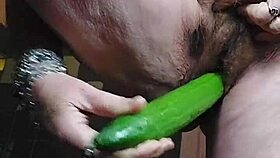 granny rams cucumber deep into hairy pussy
