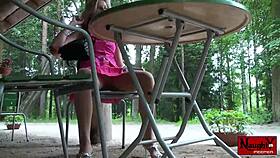 a curious voyeur peeks up the babe's skirt at her panties and nylons underneath