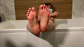 mature milf lounges in bath teasing foot fetish washing invitation