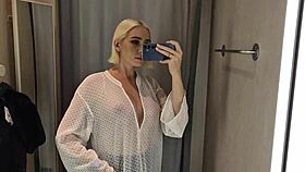Trying see-through latex outfits in mall fitting room flashing big tits 😜👙
