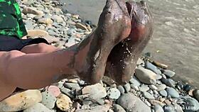 Come see my messy nylon feet up close on the riverbank in torn pantyhose