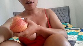 Latina fingers tight juicy pussy while savoring forbidden apple in bed