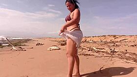 horny latina with huge ass masturbates wildly on sunny beach