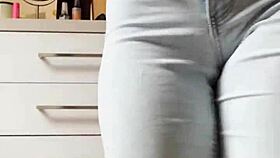 um, like, watch this cute homemade petite blonde tease stripping tight jeans off slowly...