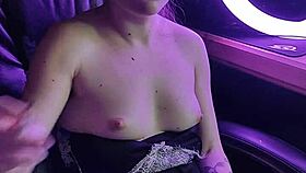 A beautiful asian lady elegantly smokes her cigarette