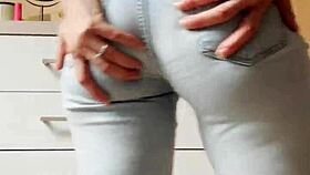 um, like, watch this cute homemade petite blonde tease stripping tight jeans off slowly...