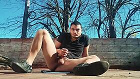 Muscular hunk strokes massive cock outdoors, wanna see him explode?