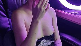 A beautiful asian lady elegantly smokes her cigarette