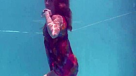 redhead nikita vodorezova strips naked fast underwater at beach