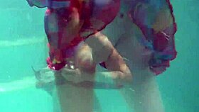 redhead nikita vodorezova strips naked fast underwater at beach