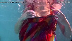 redhead nikita vodorezova strips naked fast underwater at beach