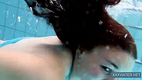 Hot hungarian teen 18+ dives underwater for shaved pussy pool teasing.