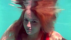 redhead nikita vodorezova strips naked fast underwater at beach