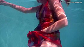 redhead nikita vodorezova strips naked fast underwater at beach