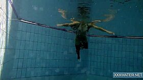 Hot hungarian teen 18+ dives underwater for shaved pussy pool teasing.