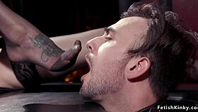 Overwhelming passion surges as busty mistress dominates male slave with intense foot worship bondage