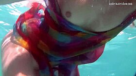 redhead nikita vodorezova strips naked fast underwater at beach