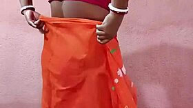 Saree-clad brunette beauty poses elegantly