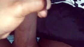stroking my big black cock before sliding into bed