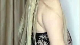 A milf in see-through clothes caresses her big natural tits slowly