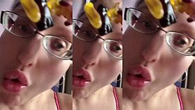 a tall girl with glasses chews food intensely in relaxing asmr session