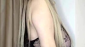 A milf in see-through clothes caresses her big natural tits slowly