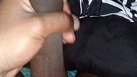 stroking my big black cock before sliding into bed