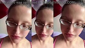 a tall girl with glasses chews food intensely in relaxing asmr session