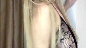A milf in see-through clothes caresses her big natural tits slowly