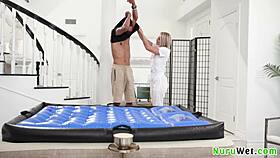 sexy blonde masseuse andi avalon slides wet nuru over scotty p's big boobs client