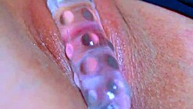 oh yeah her puffy pussy takes that glass dildo deep!