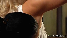 lesbian mistress straps on to dominate and pleasure bound slave's pussy