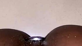 ebony slut's big pussy squirts easy from anal plug play