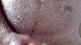 Hairy big belly mature strokes small cock to orgasm in homemade voyeur clip