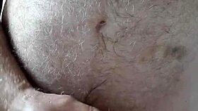 Hairy big belly mature strokes small cock to orgasm in homemade voyeur clip