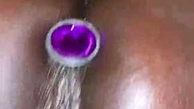 ebony slut's big pussy squirts easy from anal plug play