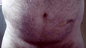 Hairy big belly mature strokes small cock to orgasm in homemade voyeur clip