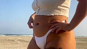 redhead beach exhibitionist flashes big swollen pussy lips