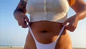 redhead beach exhibitionist flashes big swollen pussy lips