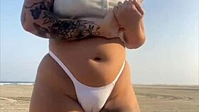redhead beach exhibitionist flashes big swollen pussy lips