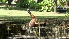 beautiful petite brunette sapphira undresses outdoors in blue metart scene