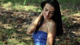 beautiful petite brunette sapphira undresses outdoors in blue metart scene