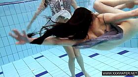 shaved brunette babe with massive tits teases underwater in the pool shower