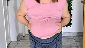 Those giant mature boobs swing free without a bra to the music in hot striptease