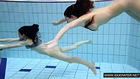 shaved brunette babe with massive tits teases underwater in the pool shower