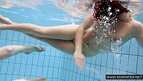 shaved brunette babe with massive tits teases underwater in the pool shower
