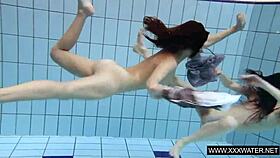 shaved brunette babe with massive tits teases underwater in the pool shower