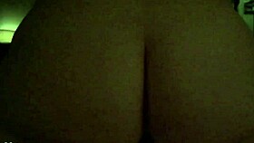Wife bounces energetically in reverse position during slow motion with glistening skin