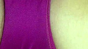 Spreading wet lips wide during erotic panty massage