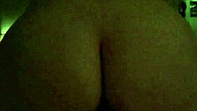 Wife bounces energetically in reverse position during slow motion with glistening skin